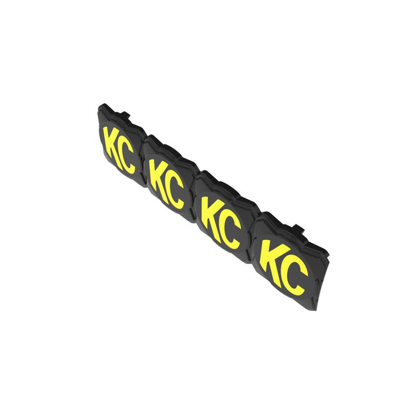 KC HiLiTES FLEX ERA LED Light Bar 10" Cover & Shield on a studio background: black FLEX ERA light bar cover with four yellow KC logos at a diagonal angle