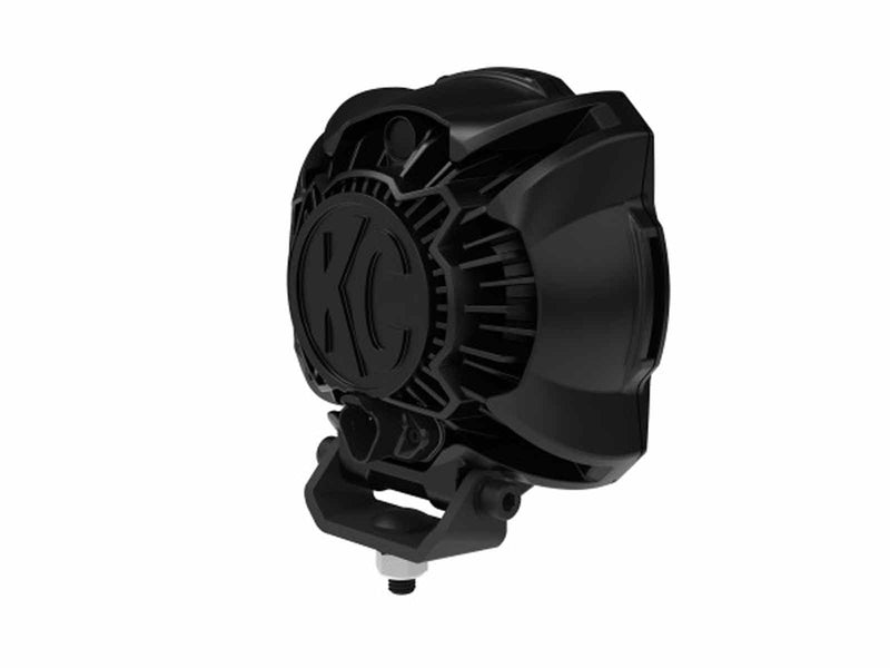 Close-up of the KC HiLiTES Gravity Titan 6" LED Light: rear angled view of a black LED light housing with a cast KC logo on the heat sink and a single-bolt mount