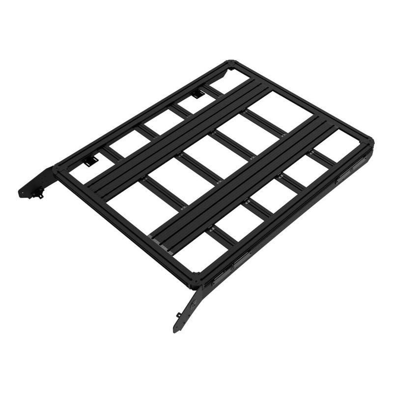 KC HiLiTES Platform One Roof Rack on a studio background: black aluminum KC Platform One roof rack with slotted crossbars and side mounting brackets, elevated top-down three-quarter view on a white background