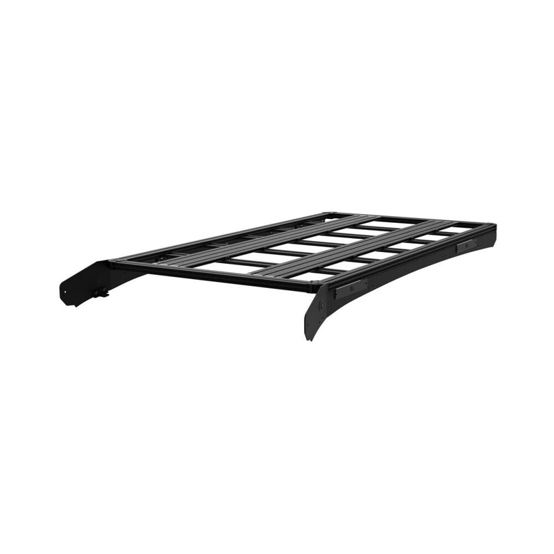 KC HiLiTES Platform One Roof Rack on a studio background: black aluminum KC Platform One roof rack with slotted crossbars and side mounting brackets, front three-quarter view on a white background