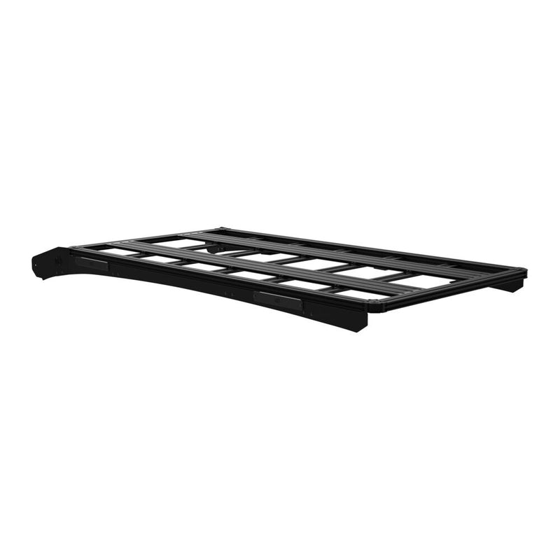 KC HiLiTES Platform One Roof Rack on a studio background: black aluminum KC Platform One roof rack with slotted crossbars and side mounting brackets, side three-quarter view on a white background