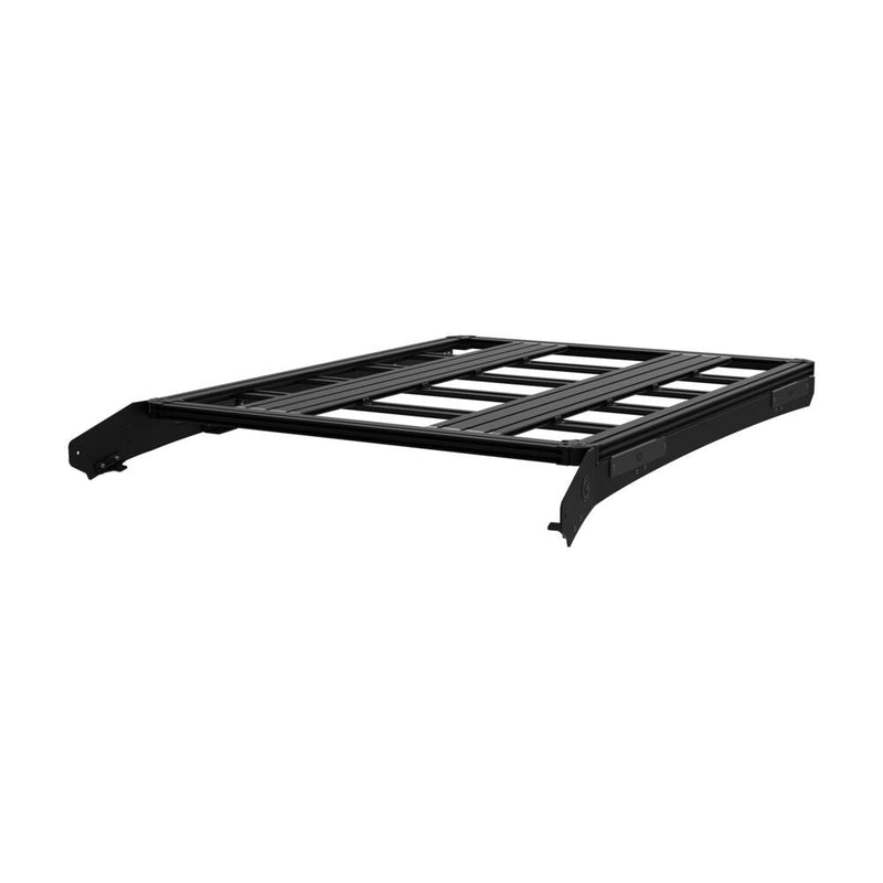 KC HiLiTES Platform One Roof Rack on a studio background: black aluminum KC Platform One roof rack with slotted crossbars and side mounting brackets, low side view on a white background