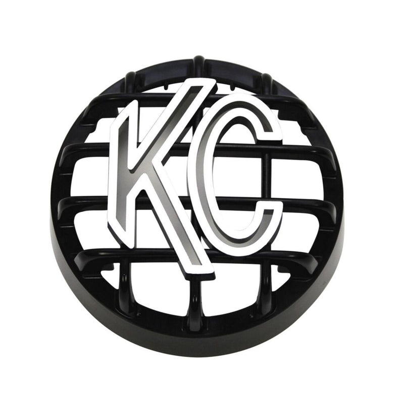KC HiLiTES Rally 400 4" Stone Guard on a studio background: black 4" round grille stone guard with a white KC logo on a white background