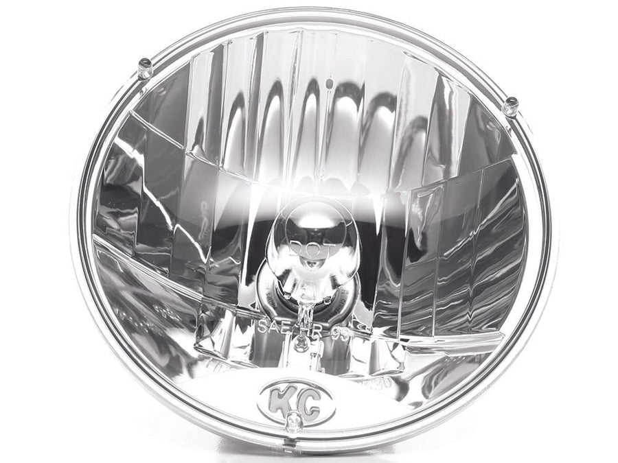 Jeep & 7" Round Headlights by KC HiLiTES: Round 7 inch clear halogen headlight with faceted reflector and KC logo on the lens, front view on white