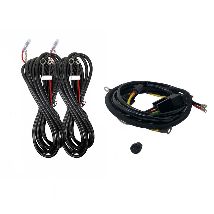 Profile SideCast Wiring Kits by KC HiLiTES: KC four-light wiring kit with two coiled light leads, a main harness with relay, and a rubber grommet on a white background