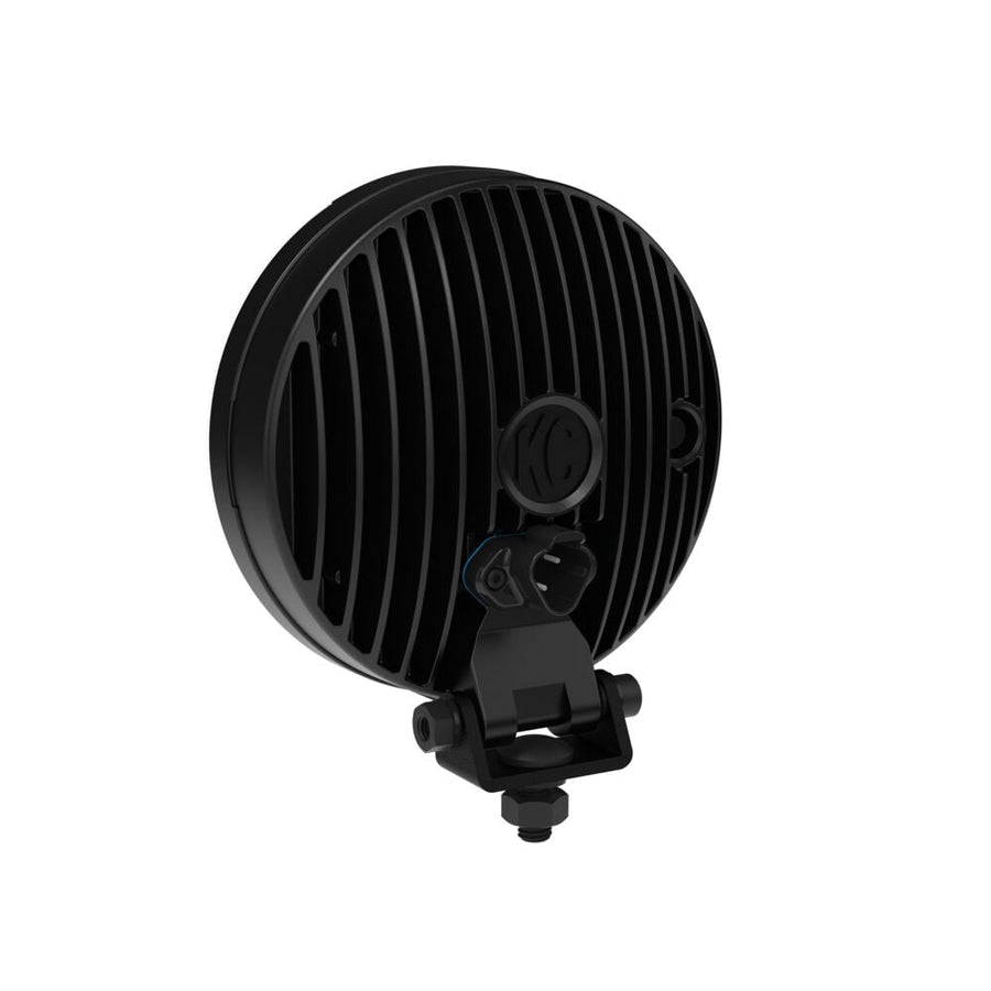 SlimLite LED Lights by KC HiLiTES: Rear three-quarter view of a black round LED light with a finned housing and mounting bracket