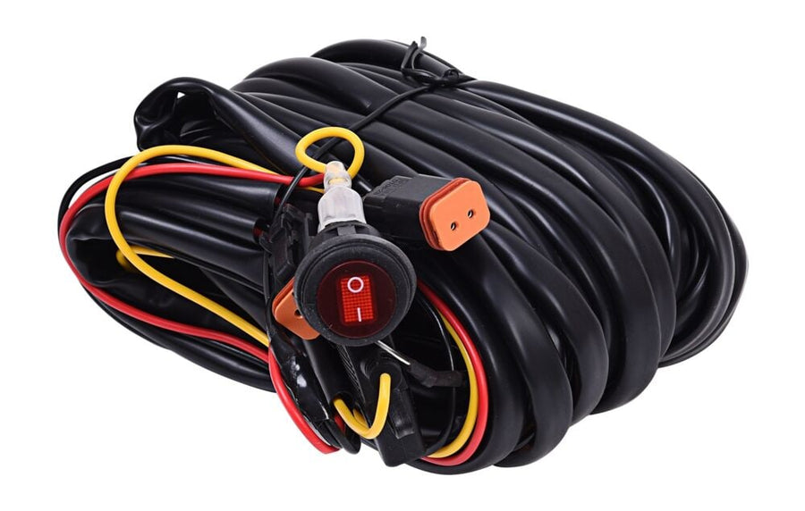Wiring, Switches & Relays by KC HiLiTES: Coiled black wiring harness with orange 2-pin Deutsch connectors, an inline fuse holder and a red lighted round rocker switch on a white background