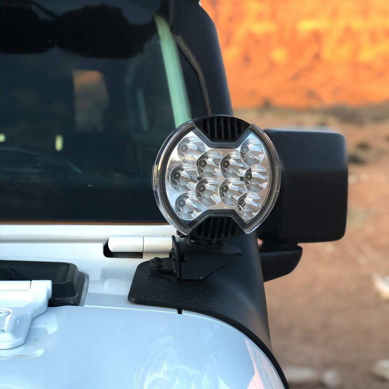 KC HiLiTES SlimLite 6" LED Light Shield on a Jeep Gladiator JT: 6" SlimLite light with a clear shield on an A-pillar mount of a white Jeep