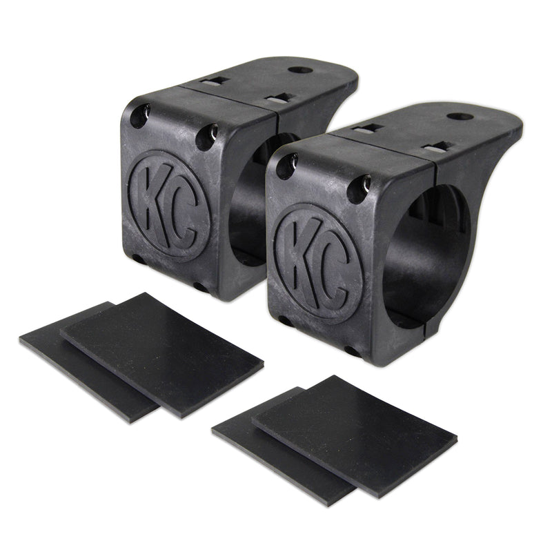 KC HiLiTES Tube Clamp Light Mount on a studio background: pair of black KC tube clamp light mounts, each with two black rubber adjustment shims on a white background