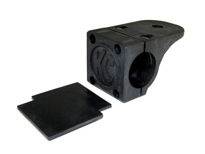 KC HiLiTES Tube Clamp Light Mount on a studio background: single black KC tube clamp light mount with two black rubber adjustment shims on a white background