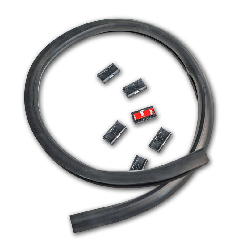 KC HiLiTES Universal Wire Hider with KClips on a studio background: black rubber wire hider strip coiled loosely with six black mounting clips on a white background