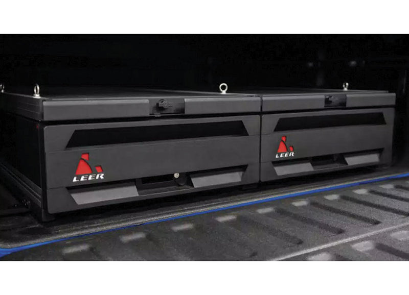 LEER NexStor truck bed drawer unit on a pickup bed: two black storage drawer units with LEER logos installed side by side in a pickup bed