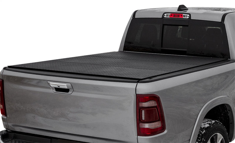 LOMAX Hard Tri-Fold tonneau cover: silver pickup on white, tri-fold closed, black diamond-plate urethane