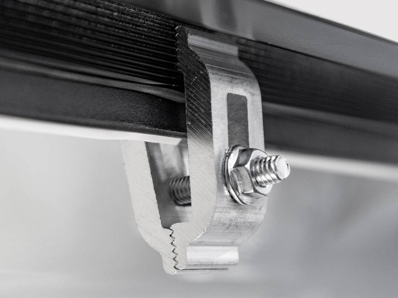 Close-up of the aluminum bed rail clamp and bolt