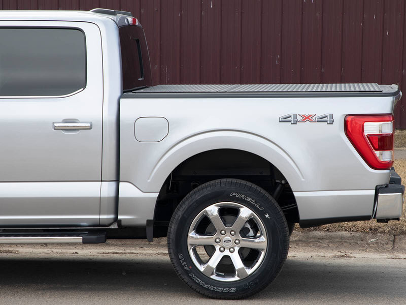Side view of a silver pickup bed with the low-profile hard cover closed