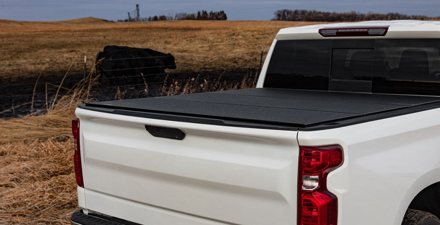 LOMAX Hard Tri-Fold tonneau cover, closed on a Chevrolet Silverado 1500