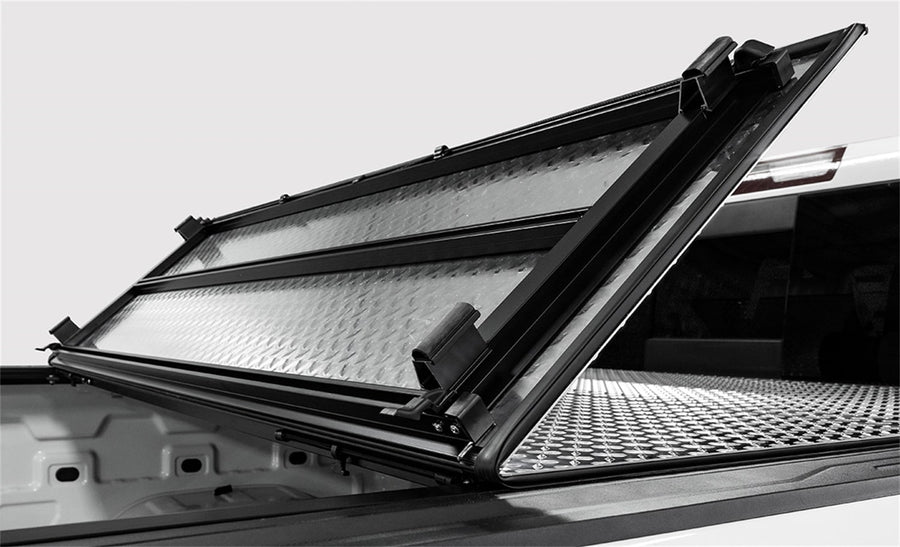 LOMAX Hard Tri-Fold tonneau cover, partly folded
