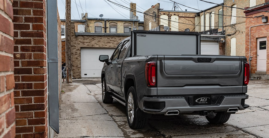 LOMAX hard folding tonneau cover, folded open at the cab on a GMC Sierra 1500