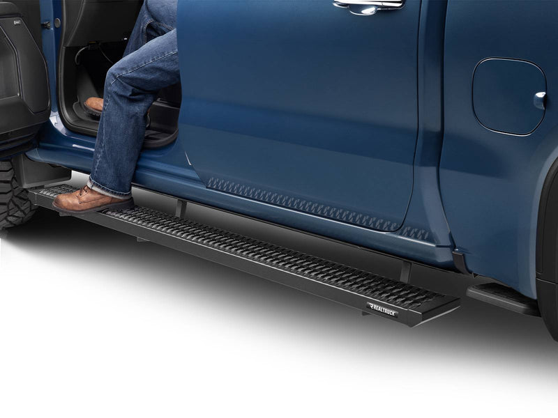 Boot stepping onto a N-Fab Growler Fleet grip-plate side step at an open blue rear door