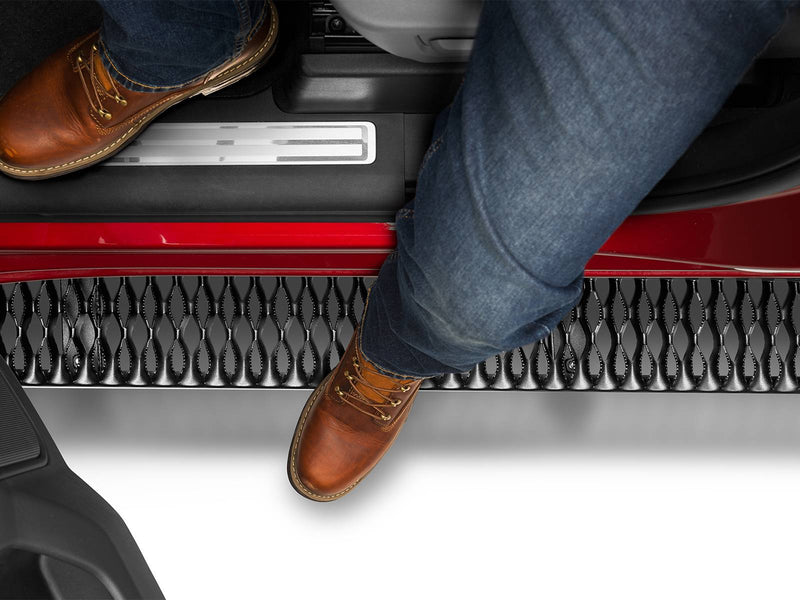 Boots stepping onto the Growler Fleet grip plate below a door sill