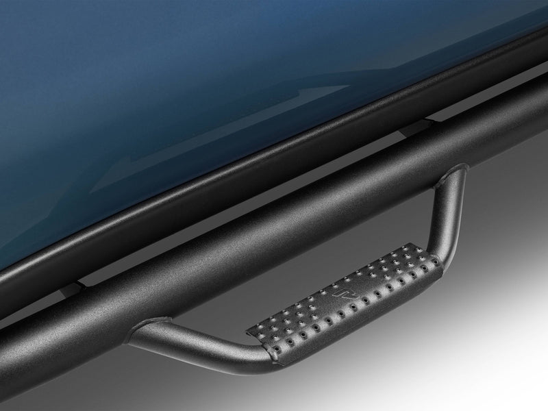 Close-up of a textured black N-Fab hoop step with perforated tread below the rocker