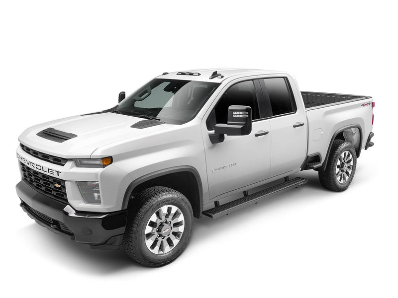 Front three-quarter view of a white Chevrolet Silverado HD double cab fitted with N-Fab Growler Fleet grip-plate side steps