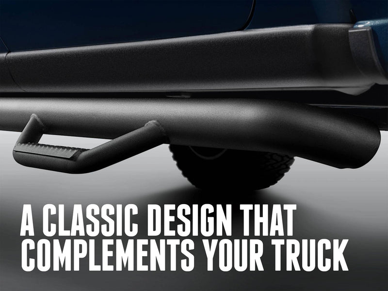 Low view of an N-Fab hoop step and main tube along a blue pickup, captioned A classic design that complements your truck