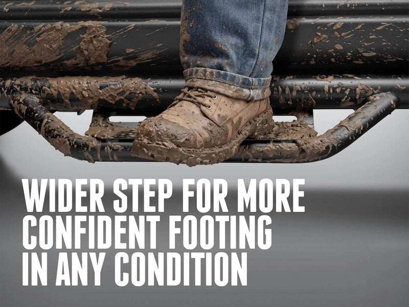 Muddy boot on an N-Fab Nerf Step RS hoop step, captioned Wider step for more confident footing in any condition