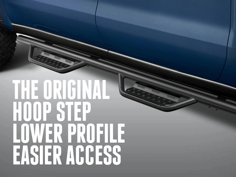 N-Fab Nerf Step RS hoop steps below the doors of a blue pickup, captioned The original hoop step, lower profile, easier access