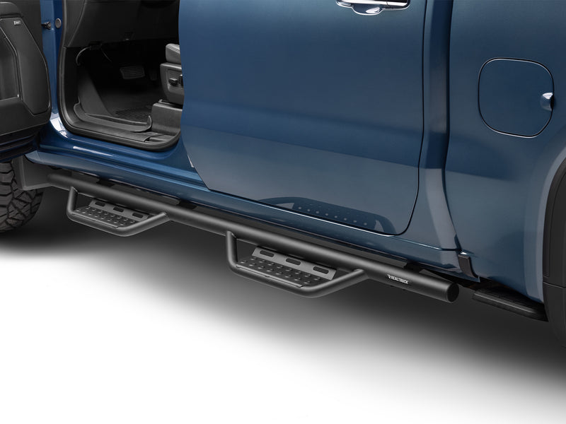 N-Fab Nerf Step RS step bars in textured black, installed along the rocker below an open door