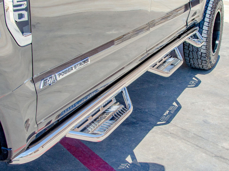 N-Fab Podium bed access nerf step bars in polished stainless, installed along the rocker