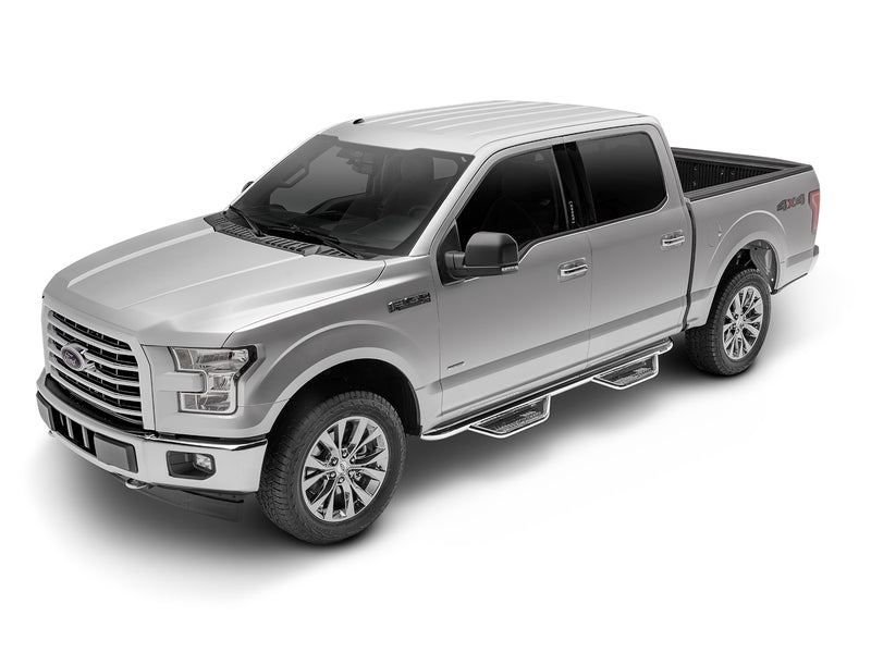 N-Fab Podium cab length nerf step bars in polished stainless, front three-quarter view, installed along the rocker