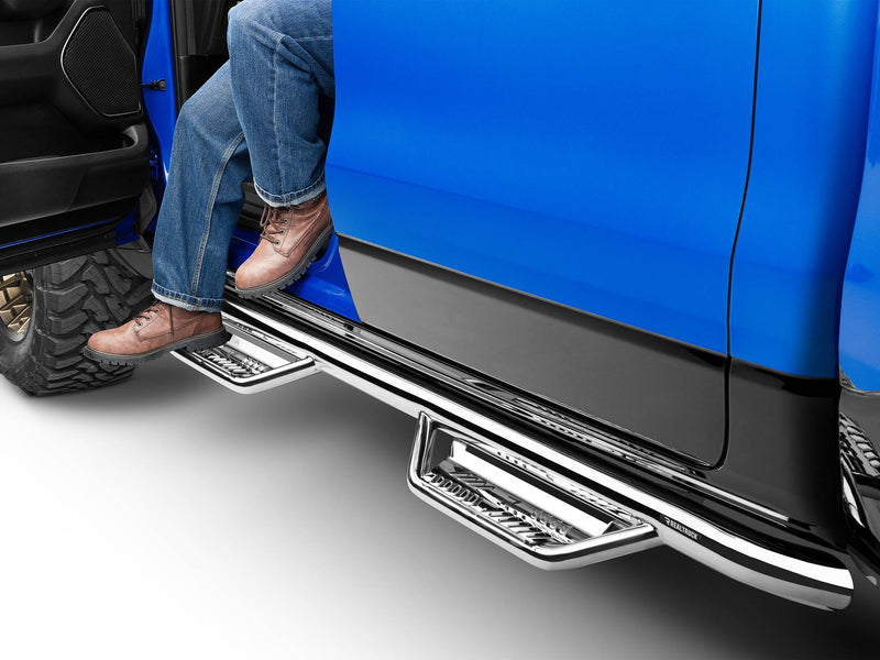 N-Fab Podium cab length nerf step bars in polished stainless, boot on the step at an open door