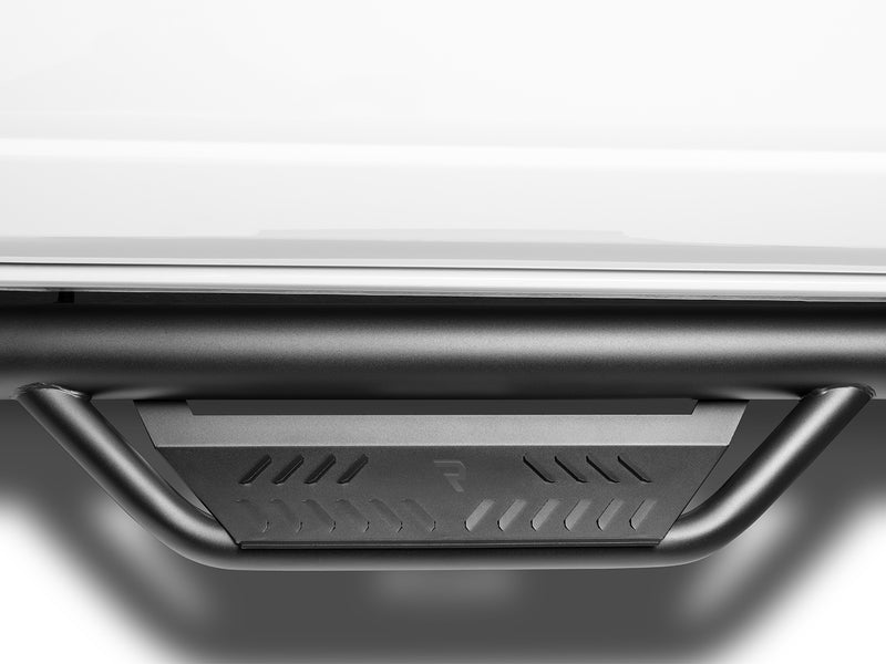 N-Fab Podium cab length nerf step bars in textured black, step tread macro, on a Ford Bronco