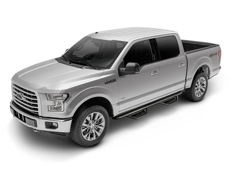 N-Fab Podium cab length nerf step bars in textured black, front three-quarter view, installed along the rocker