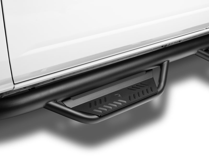 N-Fab Podium cab length nerf step bars in textured black, step close-up, on a Ford Bronco