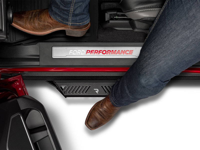 N-Fab Predator Pro nerf steps in textured black, boot on the step at an open door