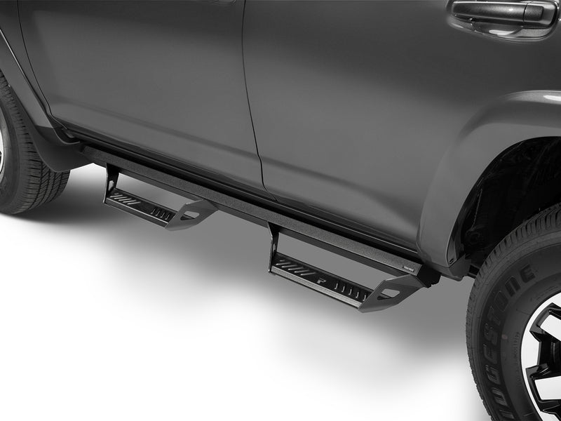 N-Fab Predator Pro nerf steps in textured black, low view, installed along the rocker, on a Toyota 4Runner
