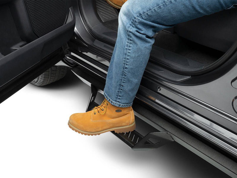 N-Fab Predator Pro nerf steps in textured black, boot on the step at an open door