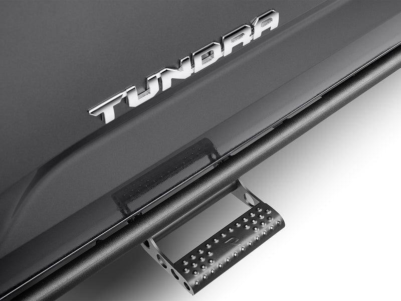 N-Fab RKR Step System in textured black, detachable step on the rail close-up, on a Toyota Tundra
