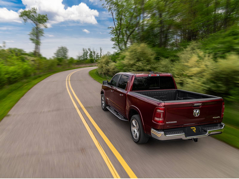 N-Fab Roan running boards in textured black, installed along the rocker, shown with a rear bumper (not included), on a Ram 1500