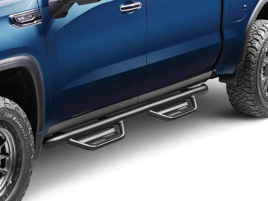 N-Fab Podium cab length nerf step bars in textured black, front three-quarter view, installed along the rocker