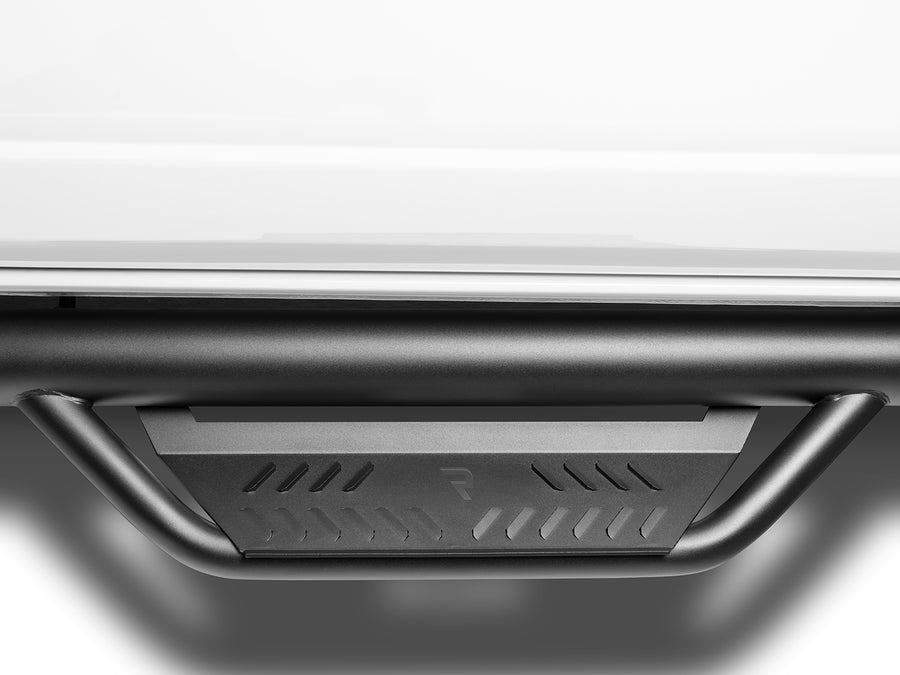 N-Fab Podium cab length nerf step bars in textured black, step tread macro