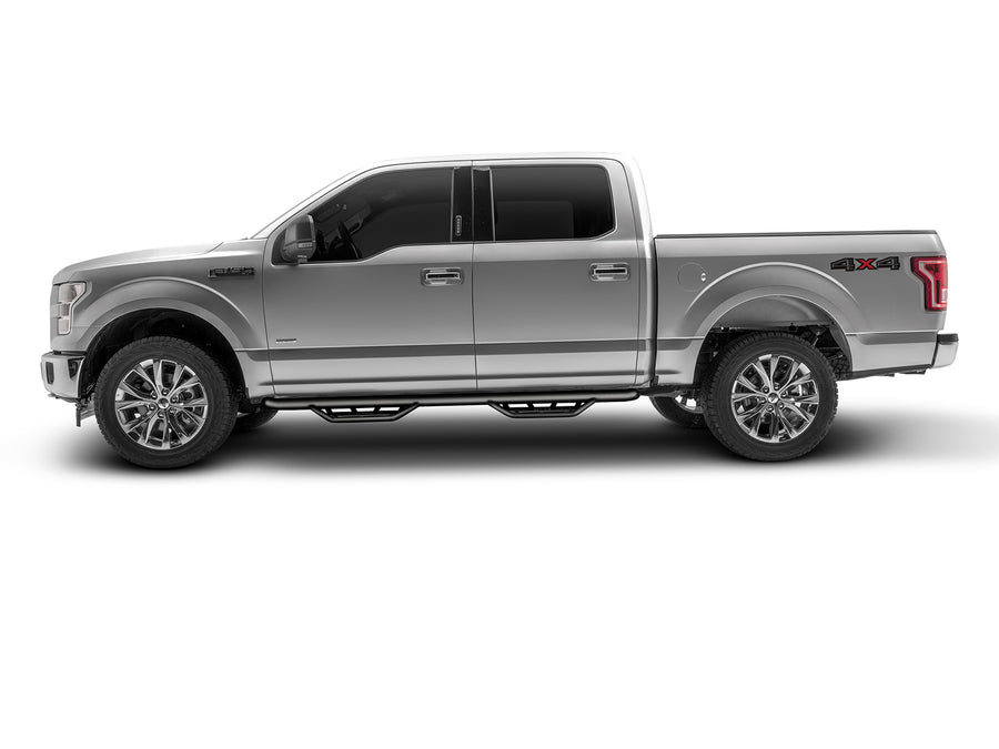 N-Fab Podium cab length nerf step bars in textured black, side profile, installed along the rocker