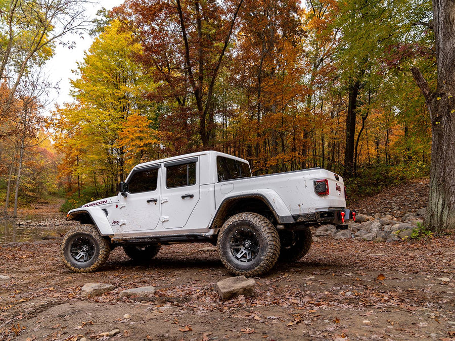N-Fab TrailSlider step system in textured black, side profile, shown with a rear bumper (not included)