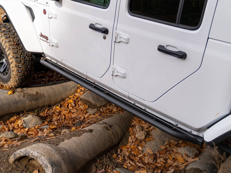 N-Fab TrailSlider step system in textured black, installed along the rocker, vehicle off-road