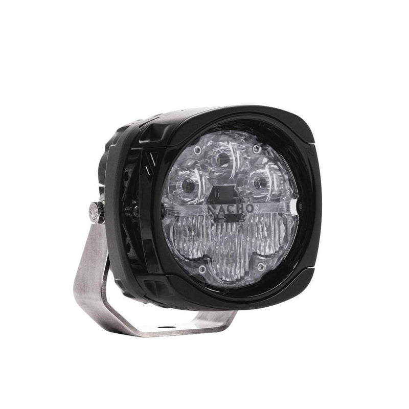 NACHO Quatro LED auxiliary light at an angle, squared black housing with a rounded clear lens showing four round spot reflectors across the top and vertical lenticular flood optics below, NACHO branding across the lens center and a stainless mount bracket