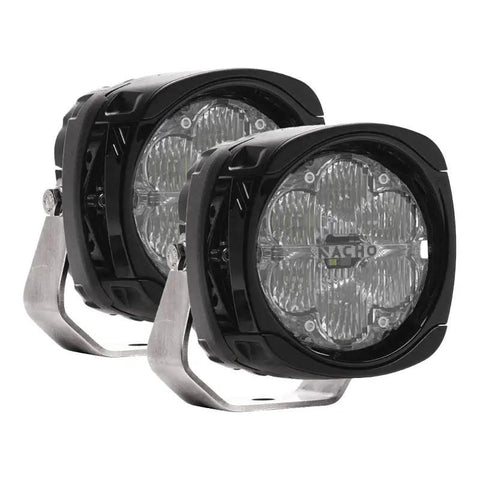 Pair of NACHO Quatro flood LED auxiliary lights on white, squared black housings with clear lenses over lenticular diffusing optics, NACHO lettering across each lens and stainless mount brackets