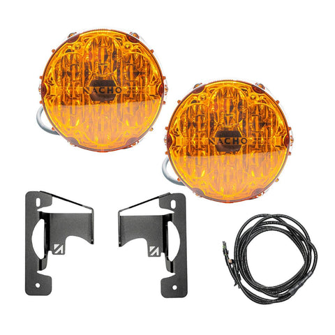 NACHO plug and play fog light kit contents on white: two amber-lens Quatro SAE round lights with pigtail leads, two black mounting brackets and a coiled loomed harness with a fuse tap