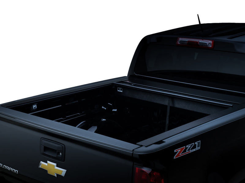 Pace Edwards JackRabbit: retractable cover fully rolled into its canister on a black pickup, bed open